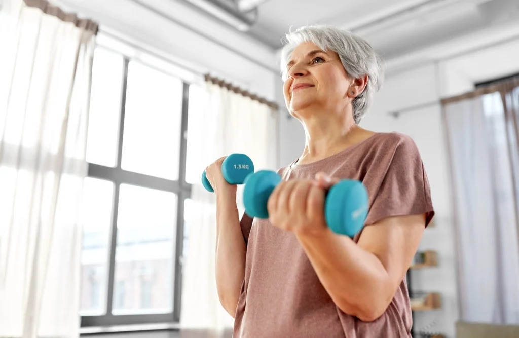 Woman exercising with dumbbells
